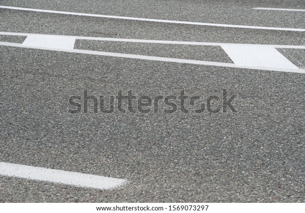 section of dry
asphalt road with road
markings