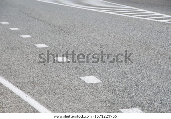 section of dry
asphalt road with road
markings