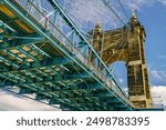 Section of historic Roebling Suspension Bridge over the Ohio River in Cincinnati downtown