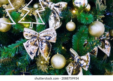 A section of a New Year's Christmas tree with toys and illumination on a gloomy winter day creates a premonition of the holiday. The Nativity Story - Shutterstock ID 2088759934