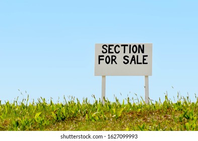 Section For Sale Sign On Empty Land. Real Estate , Property And Housing Market Concept. No People. Copy Space