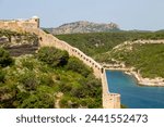 A section of the wall of the Citadel of Bonifacio perched on rugged cliffs, Bonifacio, Corsica, France, Mediterranean, Europe