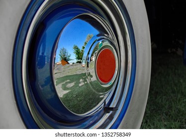 A Section Of A Whitewall Tire And Vintage Car