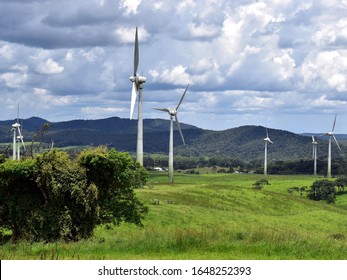 A section of a wind farm showing seven wind turbines in the Atherton Tablelands in Tropical North Queensland Australia
