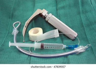 Secure the airway with this intubation equipment: Laryngoscope with medium curved (MacIntosh 3) blade, a 7.5 endotracheal tube with stylet and 10 ml syringe of air, and tape to secure the tube