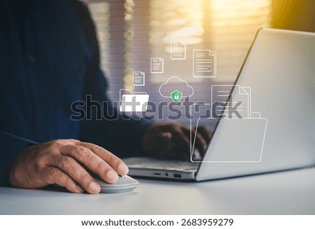 Secure cloud data storage concept, Businessman using laptop with digital folders and documents, illustrating online file management, cybersecurity, and safe digital document organization solutions