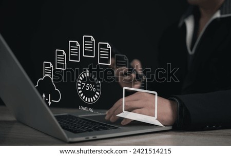 Secure Encryption File Transfer or Cybersecurity in Business : Businessman Using Laptop and Mobile for Remote Download and Upload of Documents in the Cyber World with Cloud-Based Data Security