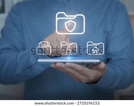 Secure file management, cloud storage, personal data protection, and modern digital organization. Digital folders and security icons float above the tablet as the user selects data.