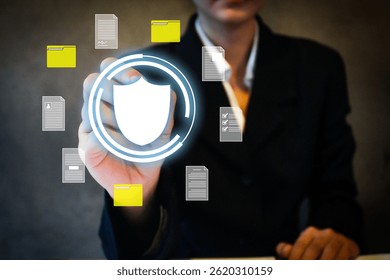Secure file protection concept image with a person pressing shield icon among floating folders and documents. Ideal for cybersecurity, data safety, encryption, and file management visuals.