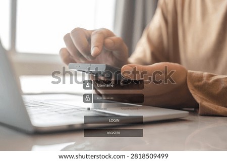 Secure online login authentication on smartphone with laptop computer, cybersecurity and data protection concept, user accessing digital account with password verification at home office.