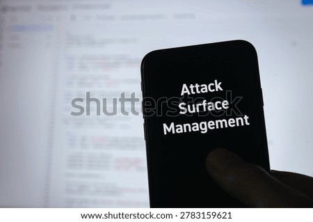 Secure technology and Attack Surface Management on smartphone with smartphone. Cyber security, protection and digital trust.