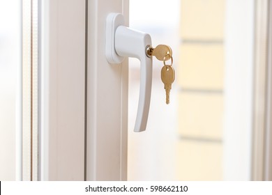 Secure Window Handle With Key In Closeup