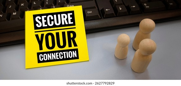 Secure Your Connection Message on Yellow Note Placed on Keyboard with Wooden Family Dolls Representing Online Safety, Cybersecurity, and Digital Protection for Families. 