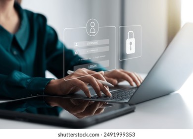 Securing cybersecurity, A Businesswoman protecting personal data on laptops and virtual interfaces, Preventing Online Theft, Cybersecurity concepts. - Powered by Shutterstock