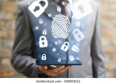 Security access fingerprint concept on tablet computer. Man offer cloud lock with fingerprint icon on tablet pc. Safety protection identification authentication authorization enter mobile technology - Shutterstock ID 530092012