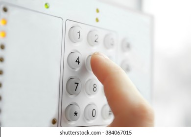 Security Alarm Keypad With Male Hand, Closeup