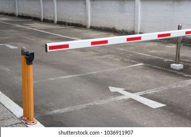 Security Barrier System At The Gate Of Car Park Background, Red And White Steel Rising Arm Access Barrier