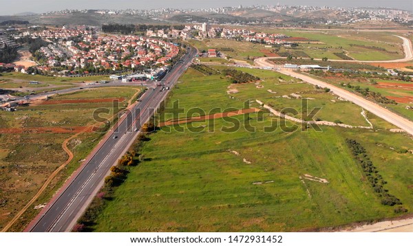 Security\
Border wall aerial View\
Aerial footage of the Israeli Palestine\
wall close to Givon  and bir nabala\
town\
