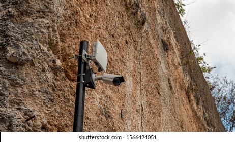  Security Camera And 5G Network In Asia On A Stone Wall 