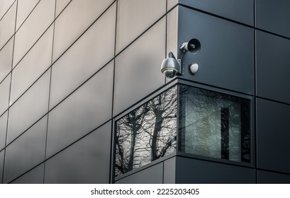 Security camera or CCTV is outsite on the wall of the modern building. Video equipment for safety system area control outdoor, The concept of Professional surveillance, Selective focus.