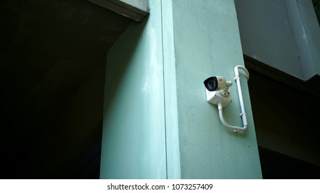 A security camera at a condominium parking space