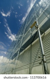 security camera in a glass facade