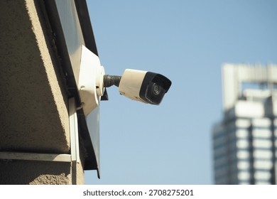 Security camera installed on a building in the city