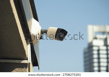Security camera installed on a building in the city