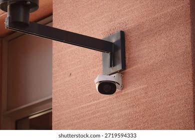 Security camera mounted on wall for surveillance purpose
