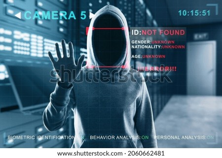 Security camera not recognizing hacker in hoodie standing in blurry server room interior. ID, scanning, data theft and cctv concept. Double exposure