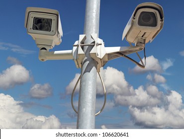 Security camera on blue sky background
