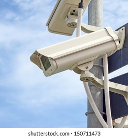 Security camera on blue sky background 