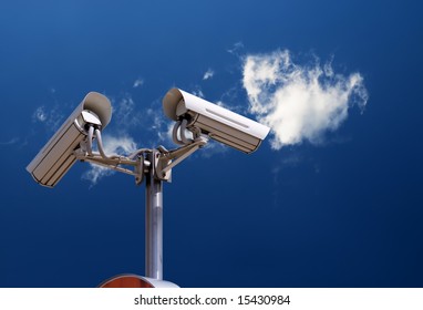 security camera on the blue sky