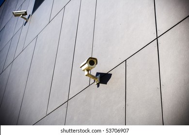 Security camera on dark grunge building
