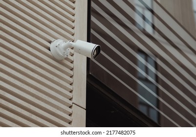 security camera on facade of corporate building