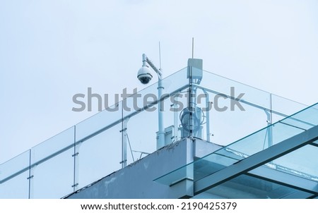 security camera on the glass fence