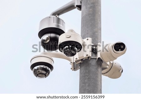 Security Camera on Pole. CCTV Camera  Videcam. Many Various Surveillance  Video Cameras Outdoor of Security System. Night Vision Camera.