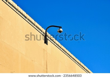 Security camera on the side of a concrete wall of the MET museum in New York City