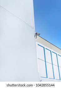 Security camera on the wall. Private property protection. CCTV camera. 