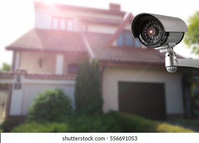 Security Camera And Private House On The Background