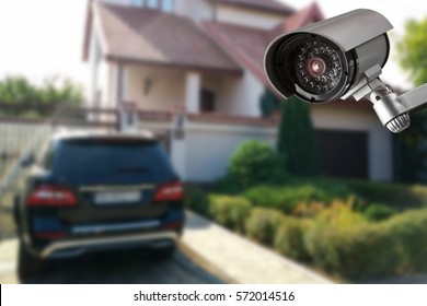 Security Camera And Private House On The Background