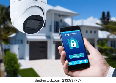 Security camera and smart home app, private house on the background