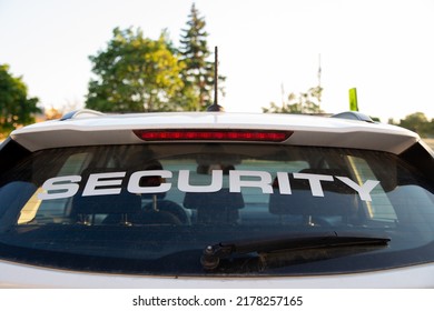 Security car patrolling streets before sunset