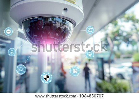 Security CCTV camera and icons at front of Supermarket.Security systems and protection from theft.Intelligent camera can record video at any time by automation.Digital Eyes.Surveillance