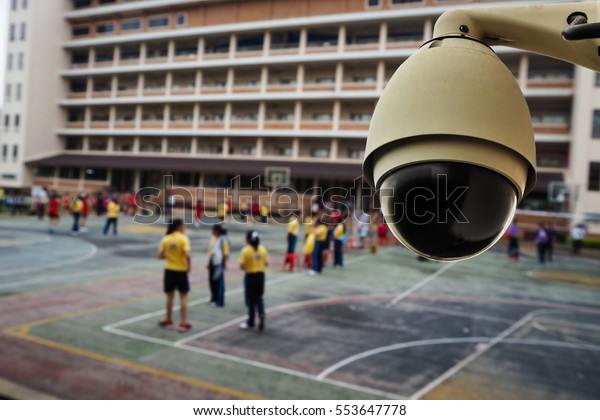 Security CCTV\
camera outside a building,\
school