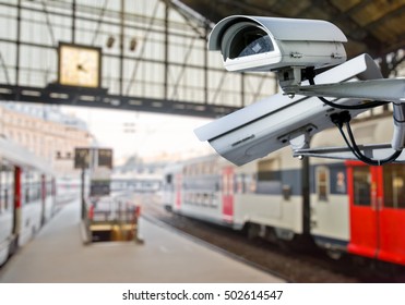 Security CCTV Camera Or Surveillance System With Railway Station On Blurry Background