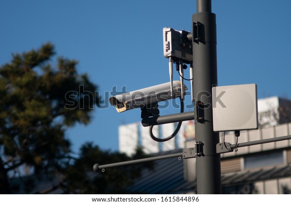 Security CCTV camera or surveillance system in\
car park, Intelligent cameras can record video all day and night to\
keep you safe from\
thieves.