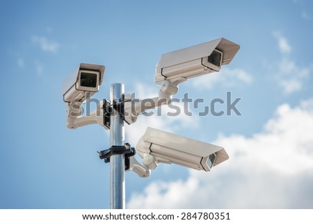 Security cctv surveillance camera in front of blue sky concept for counter-terrorism, antiterrorism and protection from crime Foto stock © 