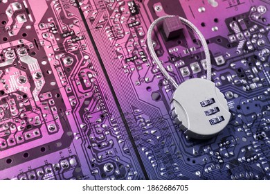 Security cipher padlock on computer circuit board.