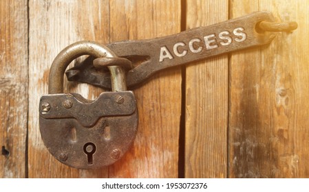Security concept. There is a lock on the door on the metal part of which it is written - ACCESS